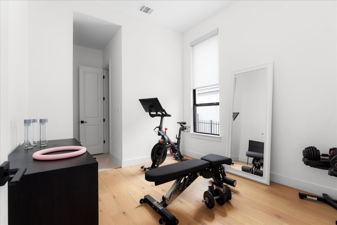 482 Running Bird Road Austin, TX 78737 - Photo 28 of 38 Currently used as a home gym, this bright bedroom offers plenty of space and flexibility for your lifestyle needs.