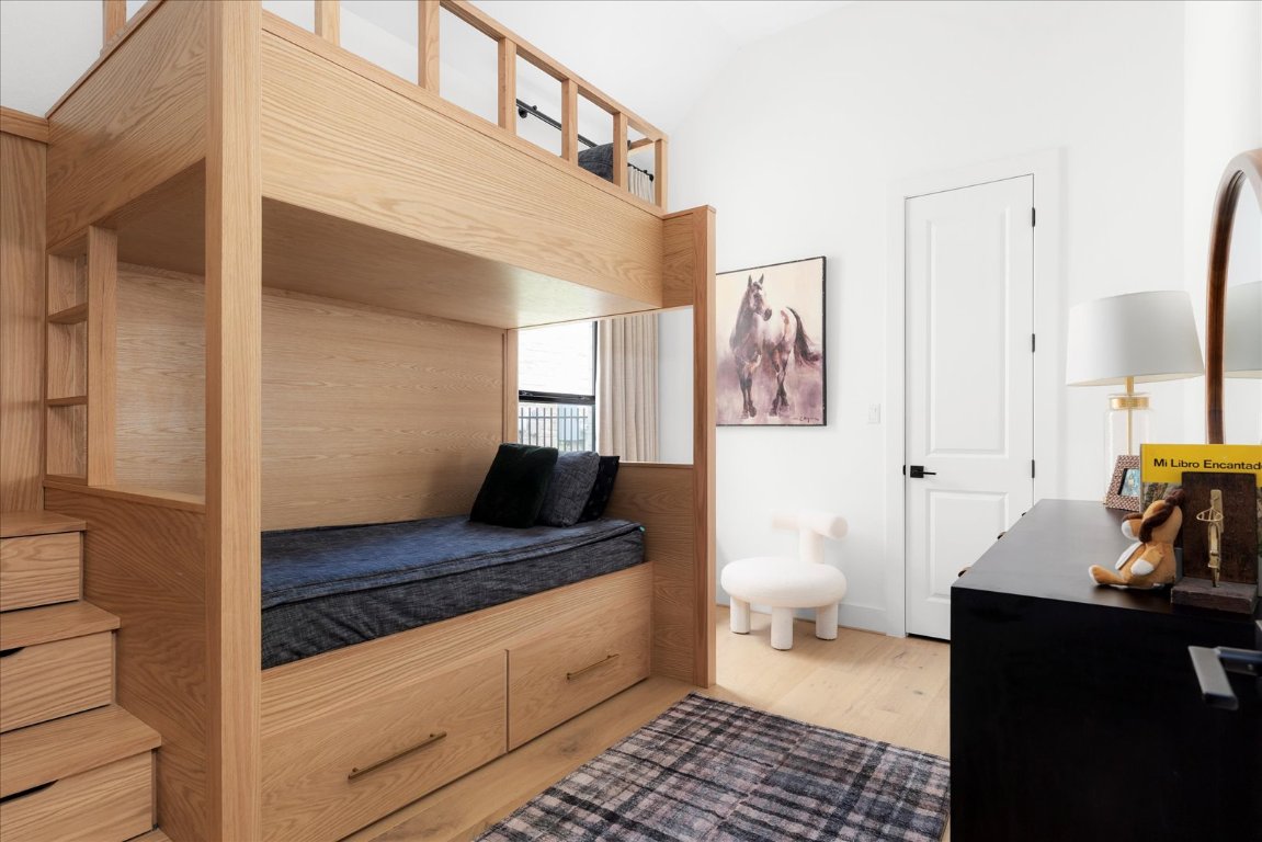 482 Running Bird Road Austin, TX 78737 - Photo 30 of 38 Perfect for family living — this bedroom includes a custom bunk bed with built-in storage and custom shades to complete the look.