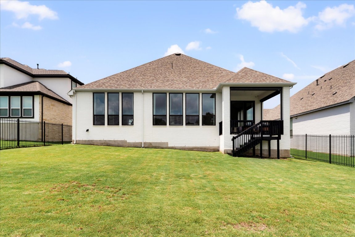 482 Running Bird Road Austin, TX 78737 - Photo 36 of 38 A spacious backyard offering privacy and greenbelt views, ideal for adding a pool or designing your perfect outdoor haven.