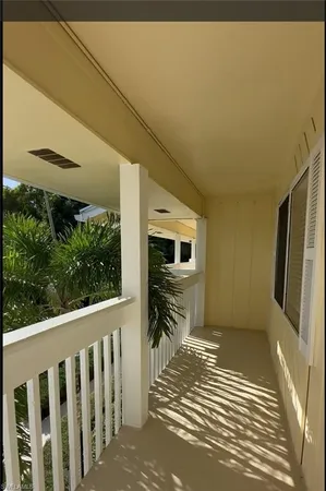 a view of a porch with wooden floor