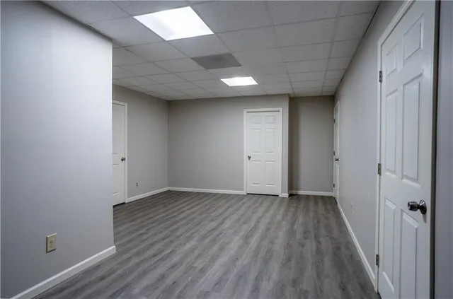 an empty room with wooden floor