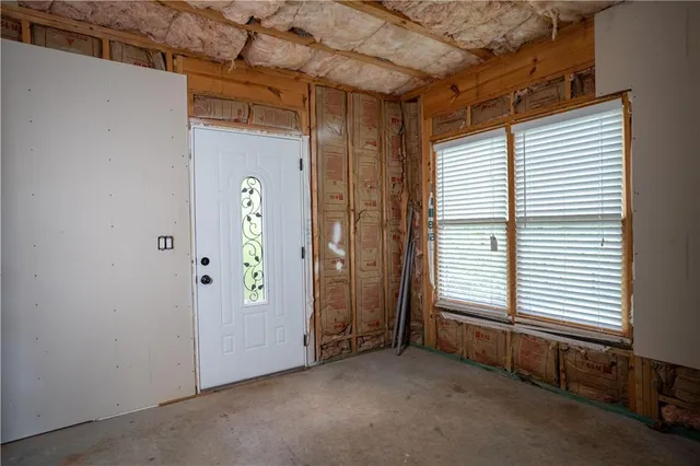 an empty room with windows