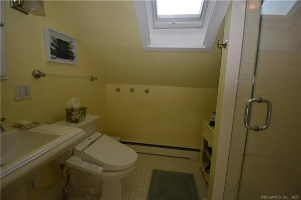 a bathroom with a sink and toilet