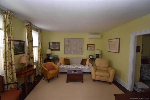 a living room with furniture and a window