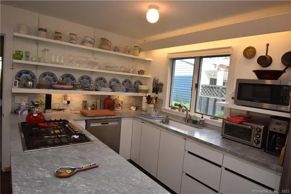 a kitchen with a stove and a sink