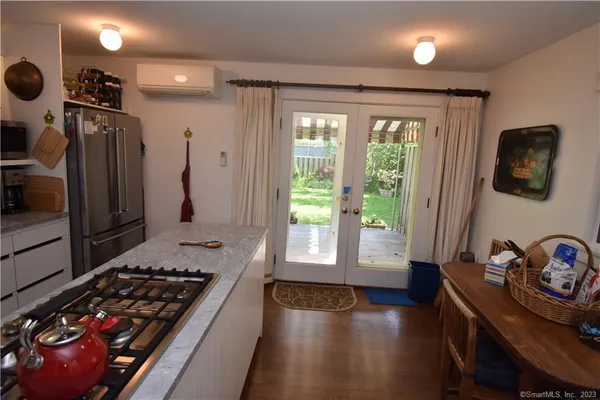 a kitchen with granite countertop a stove and a refrigerator