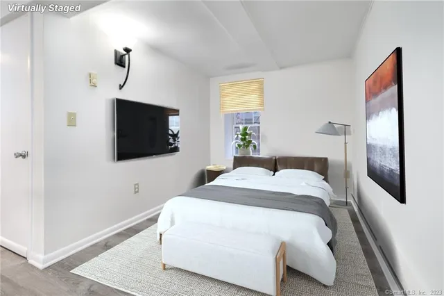 a view of a house with a yard and large tree