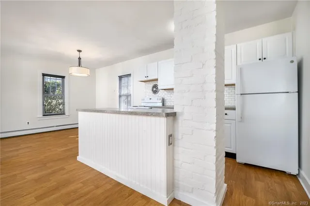 a bathroom with a sink a mirror and shower