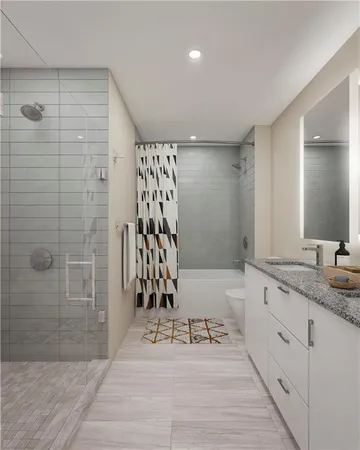 a bathroom with a granite countertop sink a mirror a bathtub and shower
