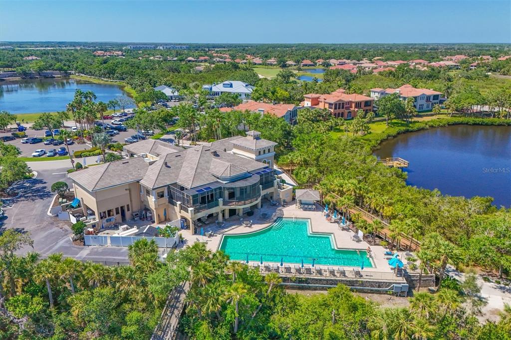 10622 Conch Shell Terrace Bradenton, FL 34212 - Photo 64 of 69 an aerial view of a house with a garden and lake view