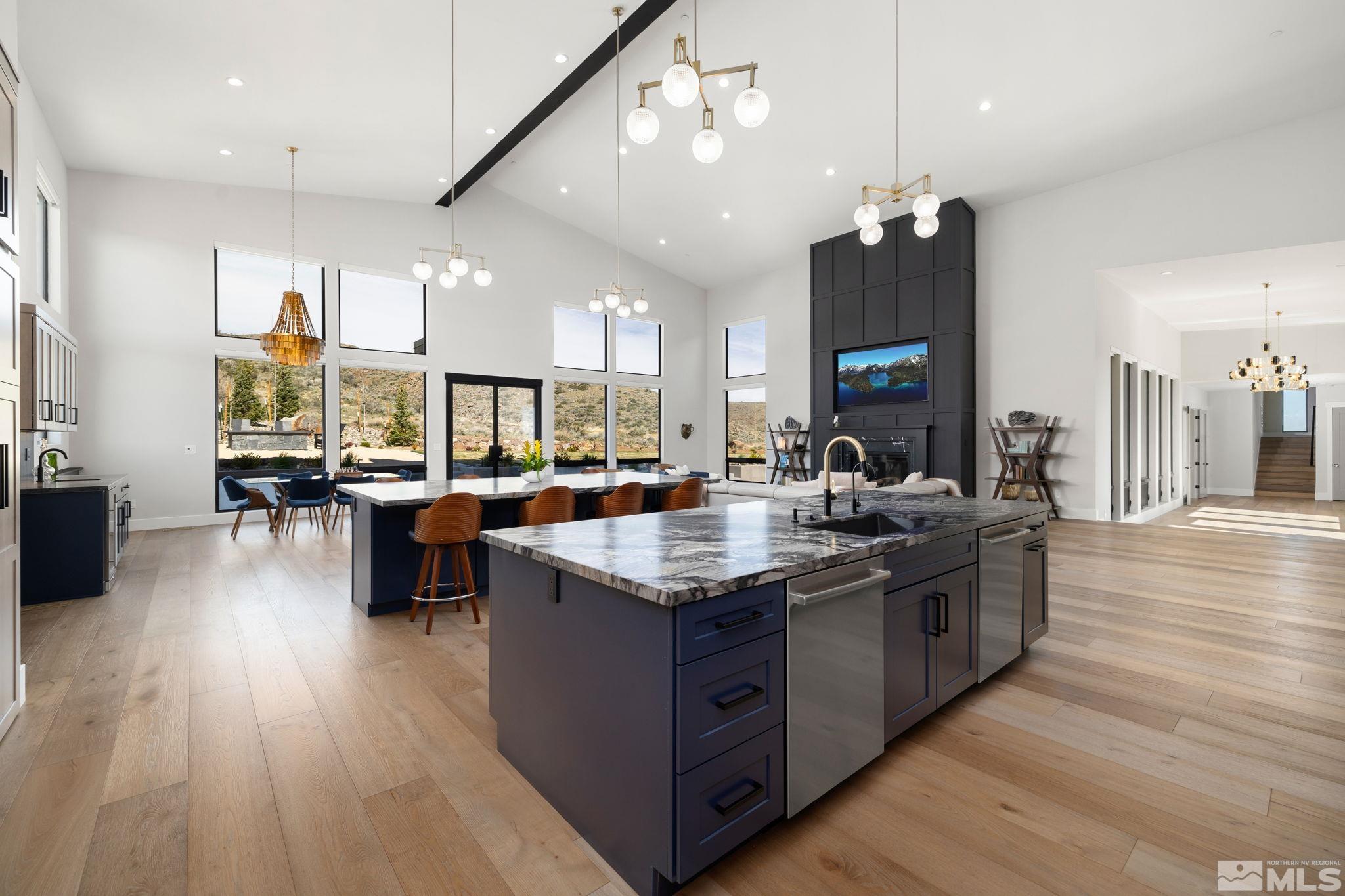 4225 Drop Tine Court Reno, NV 89511 - Photo 8 of 14 a kitchen with stainless steel appliances granite countertop a stove and a wooden floors