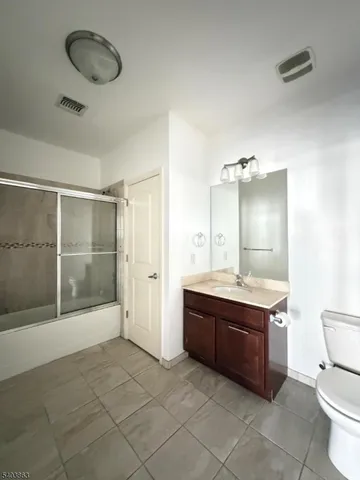 a bathroom with a mirror a bathtub and a shower