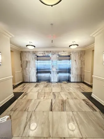 a bedroom with a bed and cabinets