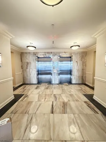 a bedroom with a bed and cabinets