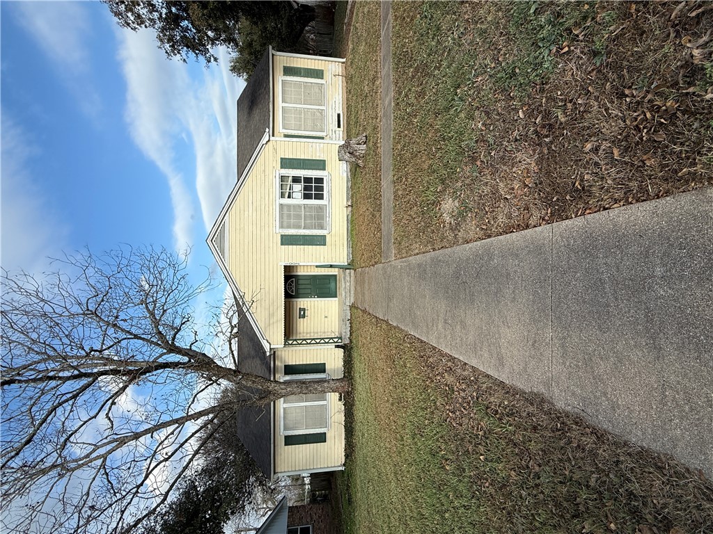 front view of a house with a yard