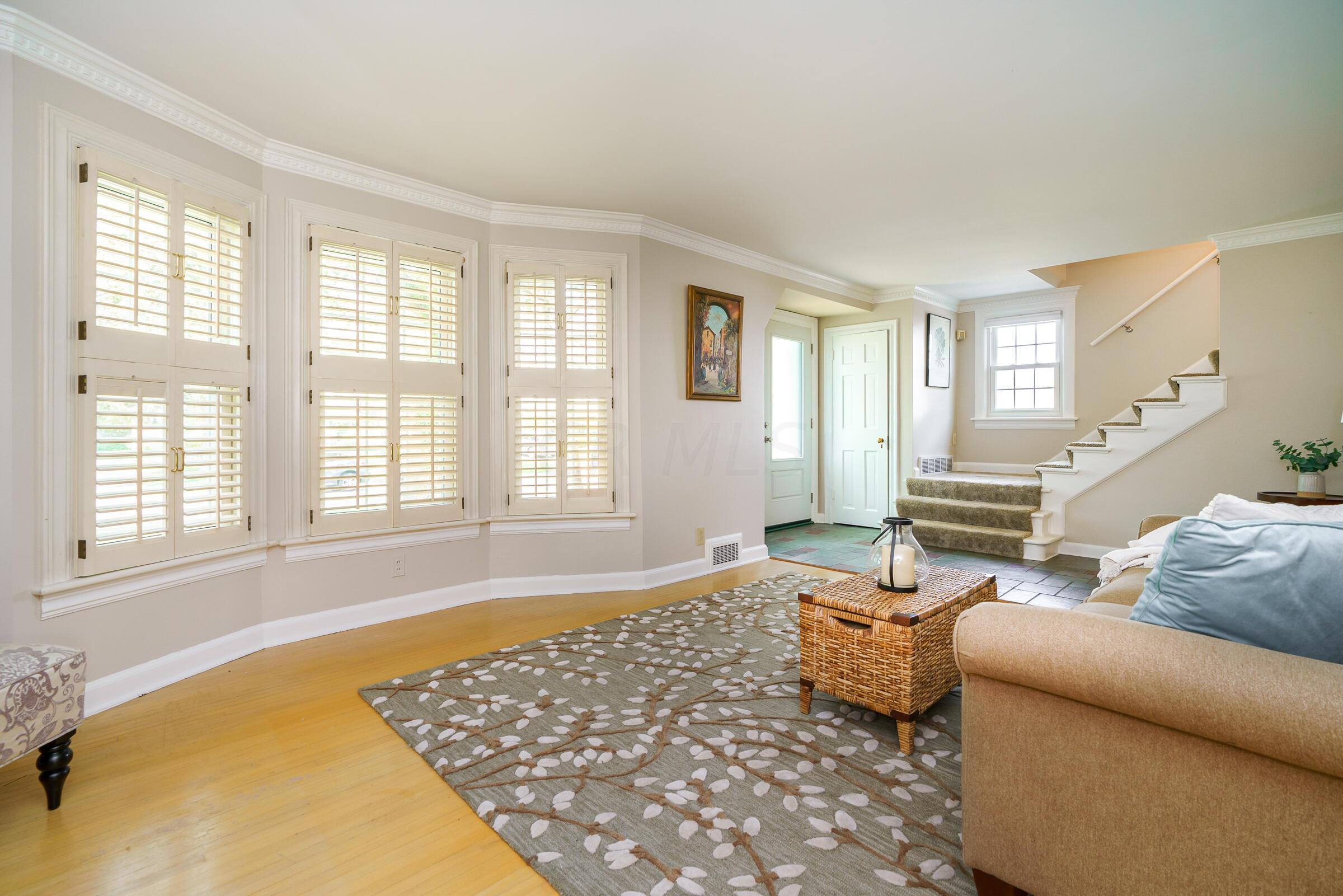 2734 York Road Upper Arlington, OH 43221 - Photo 5 of 40 Spectacular natural light pours into the living room featuring updated windows and hardwood floors.