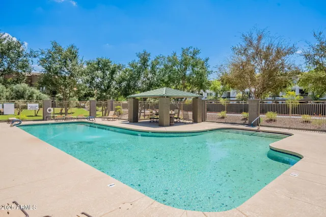a view of a swimming pool with a patio