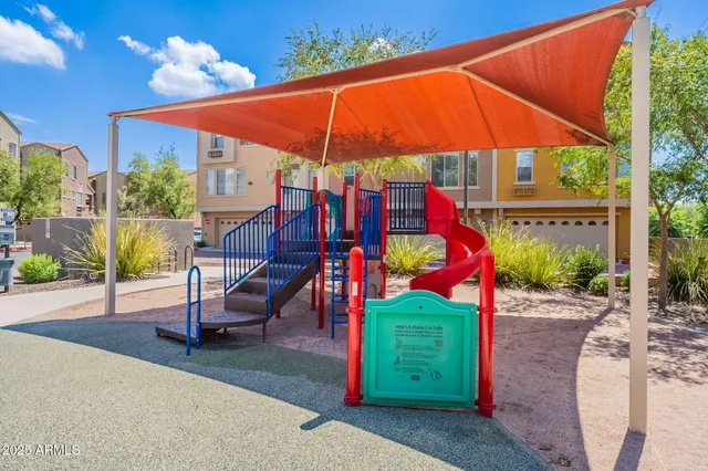 a view of a park with sitting area