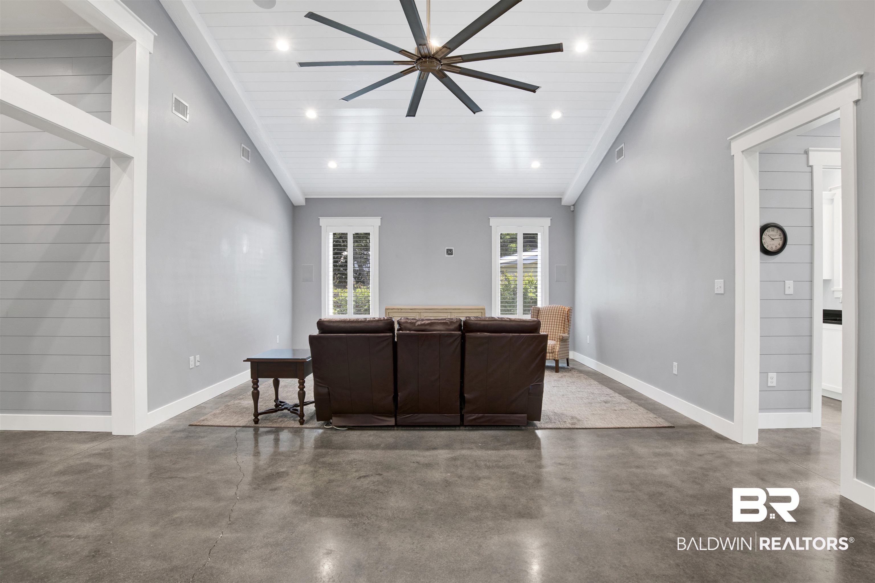 27980 Canal Road Orange Beach, AL 36561 - Photo 19 of 46 Living room featuring concrete floors, recessed lighting, high vaulted ceiling, and a ceiling fan