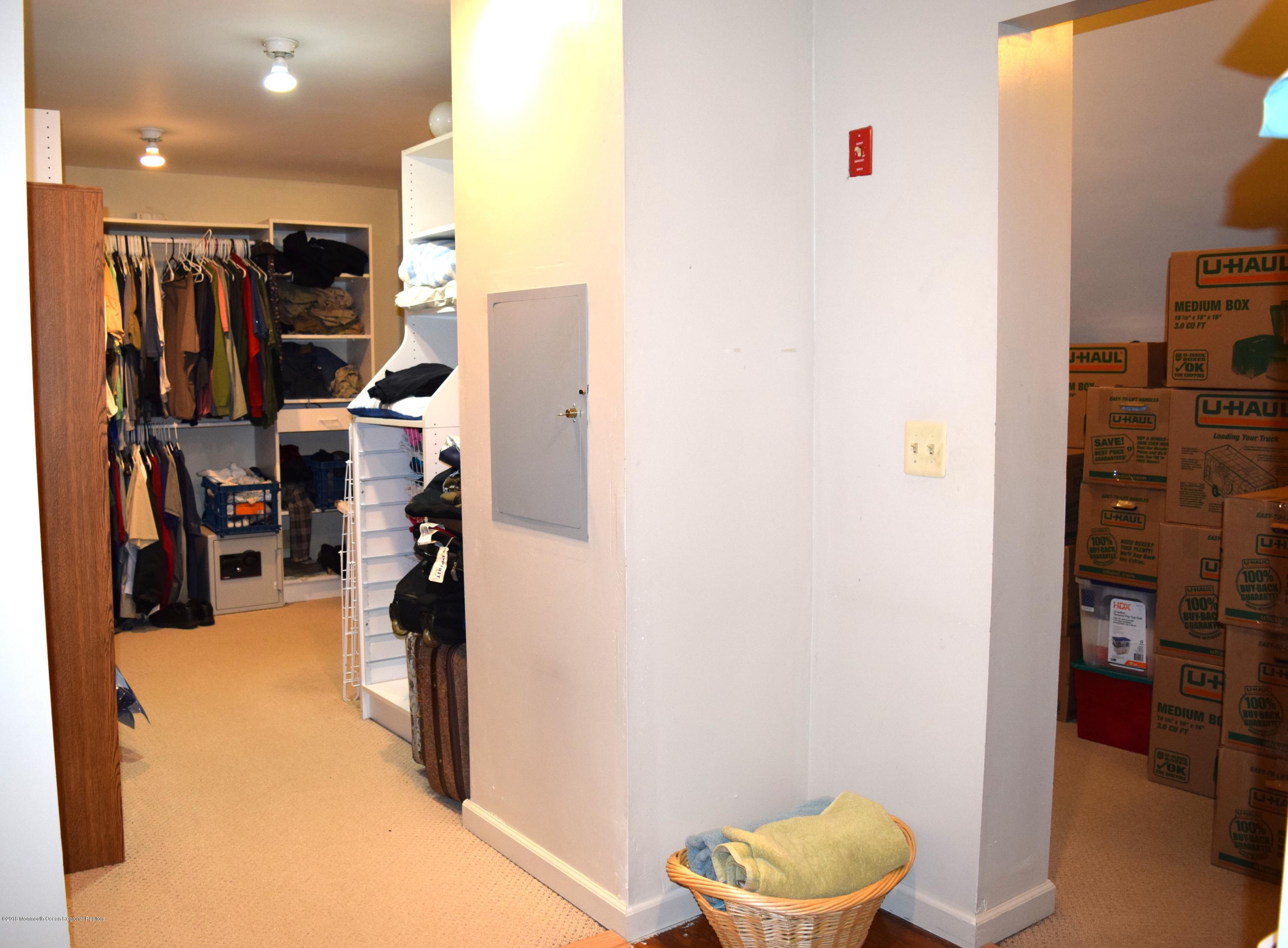 17 Dunhill Road Jackson, NJ 08527 - Photo 19 of 28 a view of walk in closet with clothes and shoes