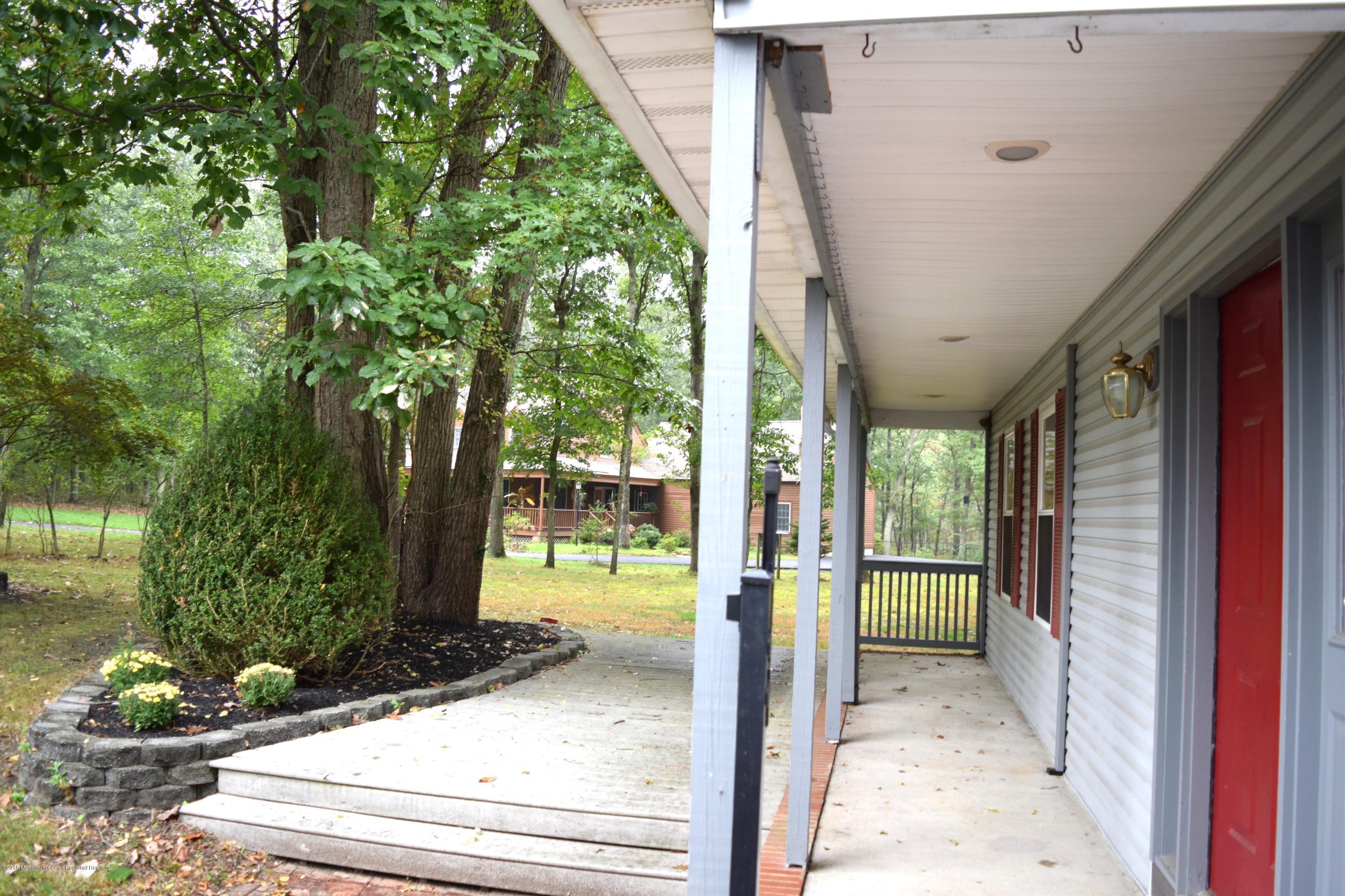 17 Dunhill Road Jackson, NJ 08527 - Photo 27 of 28 a porch with seating space and hardwood floor
