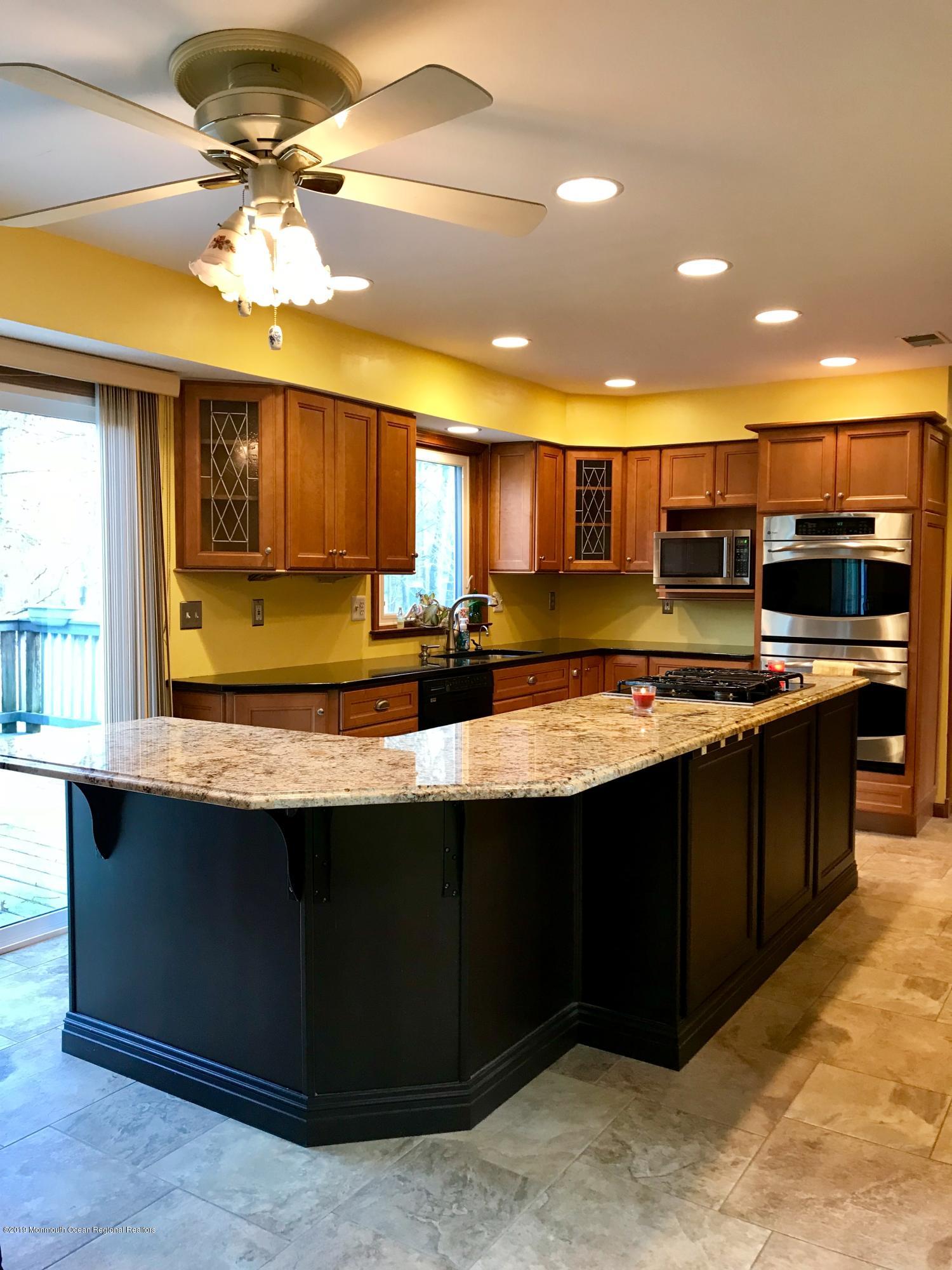 17 Dunhill Road Jackson, NJ 08527 - Photo 9 of 28 a kitchen with stainless steel appliances granite countertop a sink and a stove