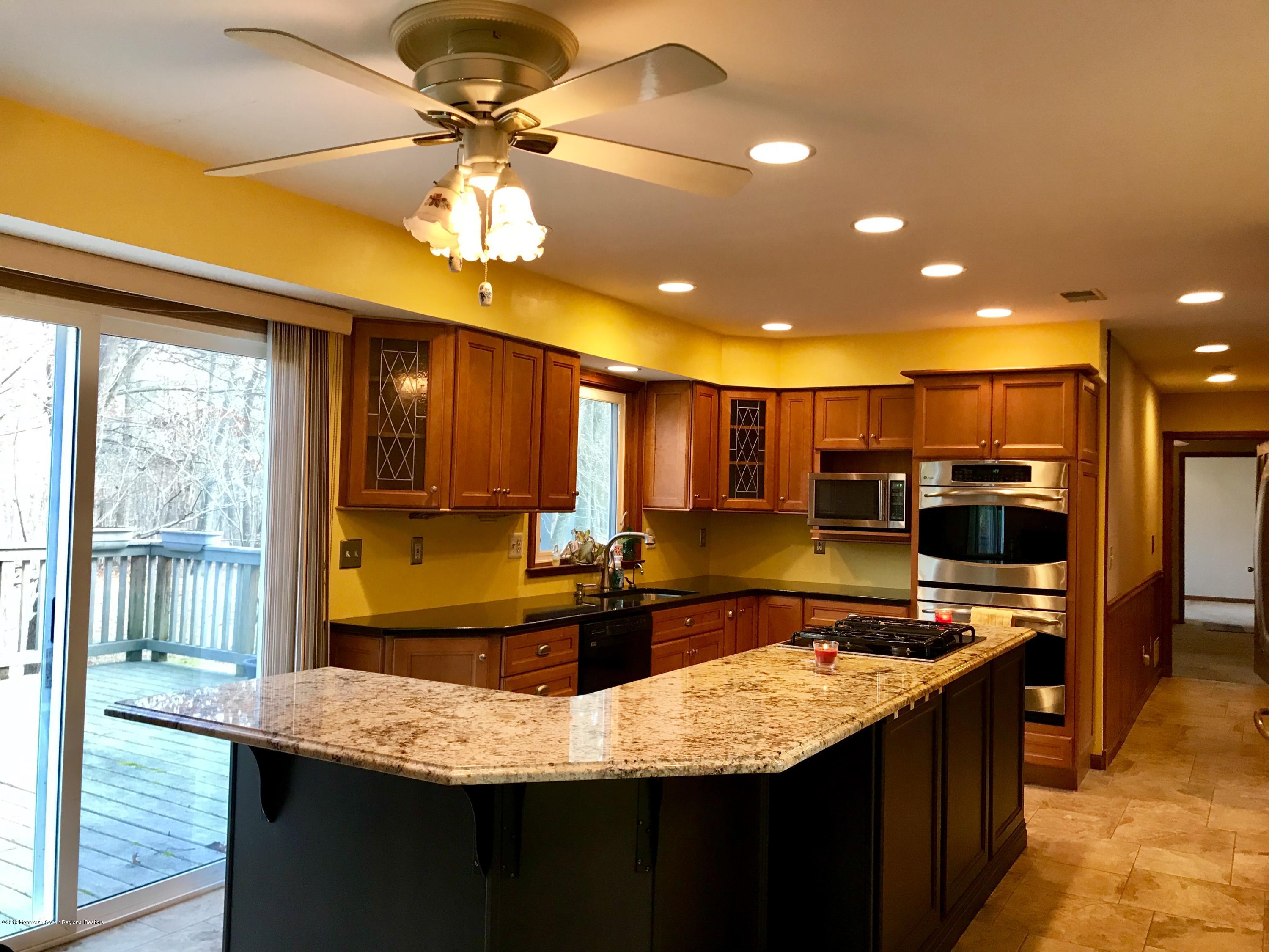 17 Dunhill Road Jackson, NJ 08527 - Photo 10 of 28 a kitchen with stainless steel appliances kitchen island granite countertop a sink and cabinets