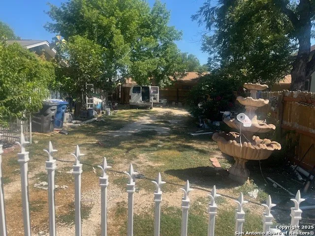 a view of a backyard of the house