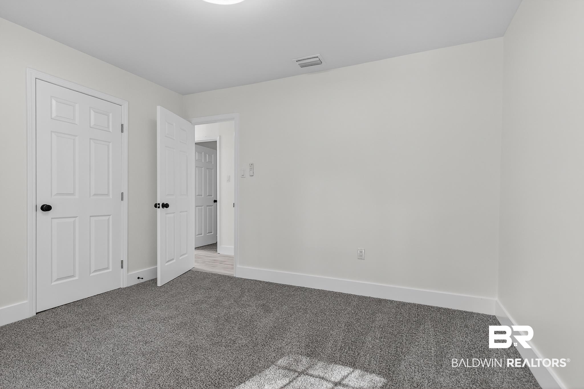10650 Old Pascagoula Road Theodore, AL 36582 - Photo 51 of 77 Unfurnished bedroom with baseboards and carpet flooring