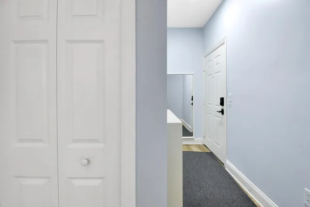 a view of a hallway with white walls