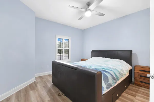 a bedroom with bed and window