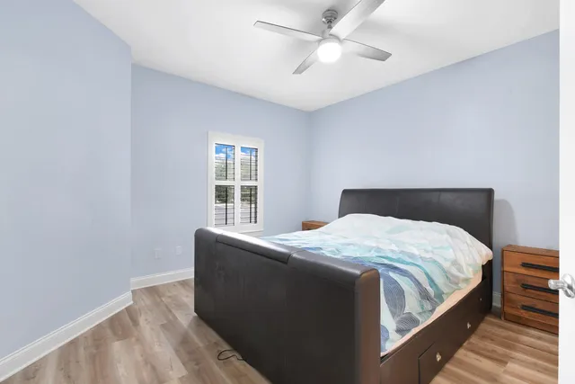 a bedroom with bed and window