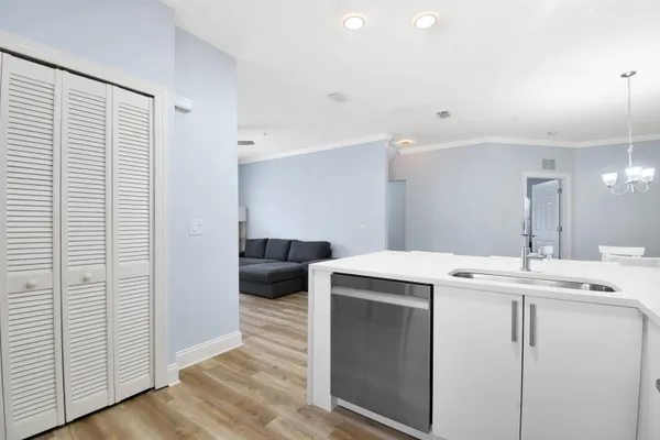 a utility room with cabinets washer and dryer