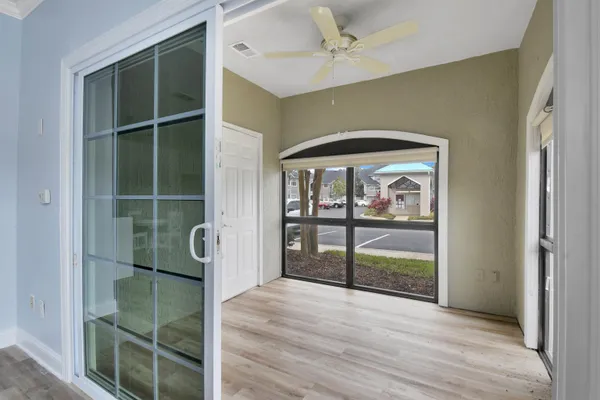 a view of a glass door with a balcony