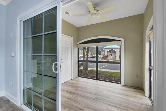 a view of a glass door with a balcony