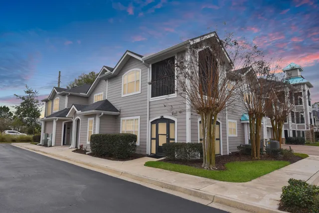a view of multiple houses with a yard