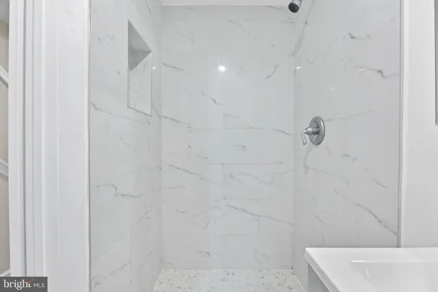 a view of wooden deck and a backyard