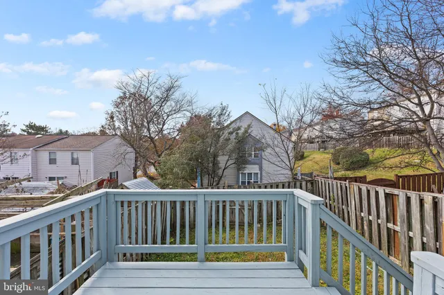 a view of a balcony with wooden floor