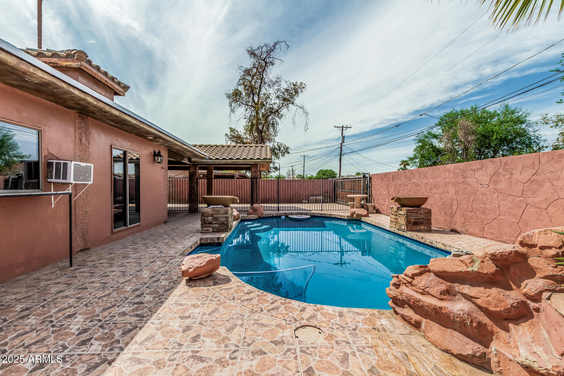 3812 West Thomas Road Phoenix, AZ 85019 - Photo 34 of 35 a view of a backyard with couches chair and wooden floor
