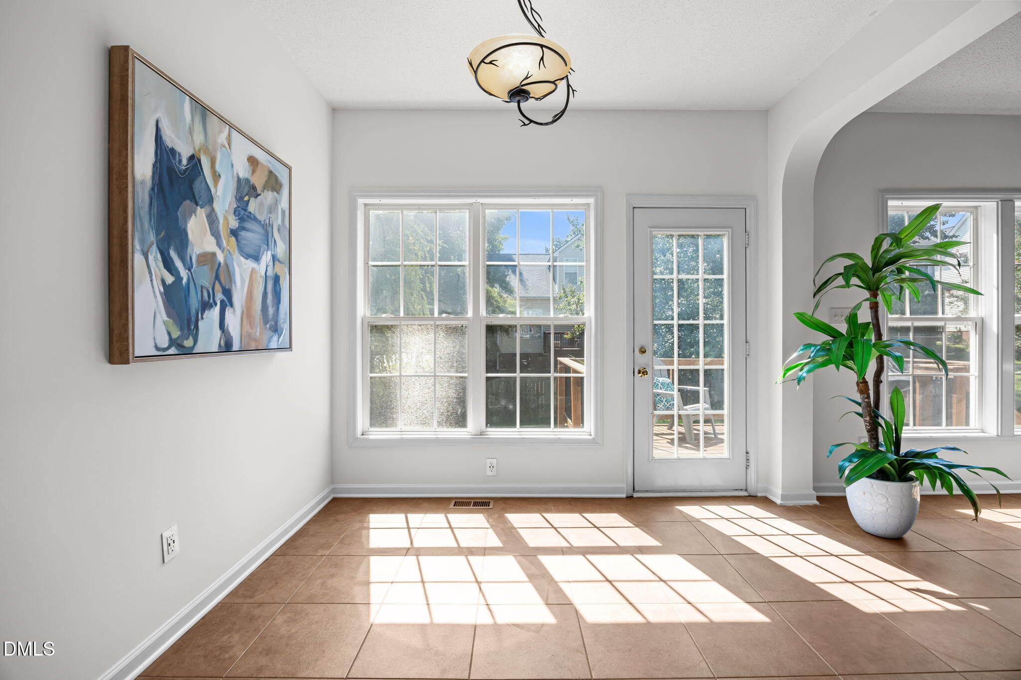 5501 Southern Cross Avenue Raleigh, NC 27606 - Photo 14 of 43 a view of an empty room with window and front door