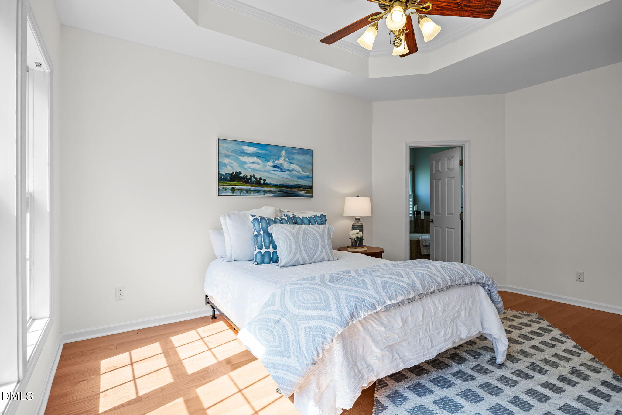 5501 Southern Cross Avenue Raleigh, NC 27606 - Photo 16 of 43 a bedroom with a bed and a painting on the wall
