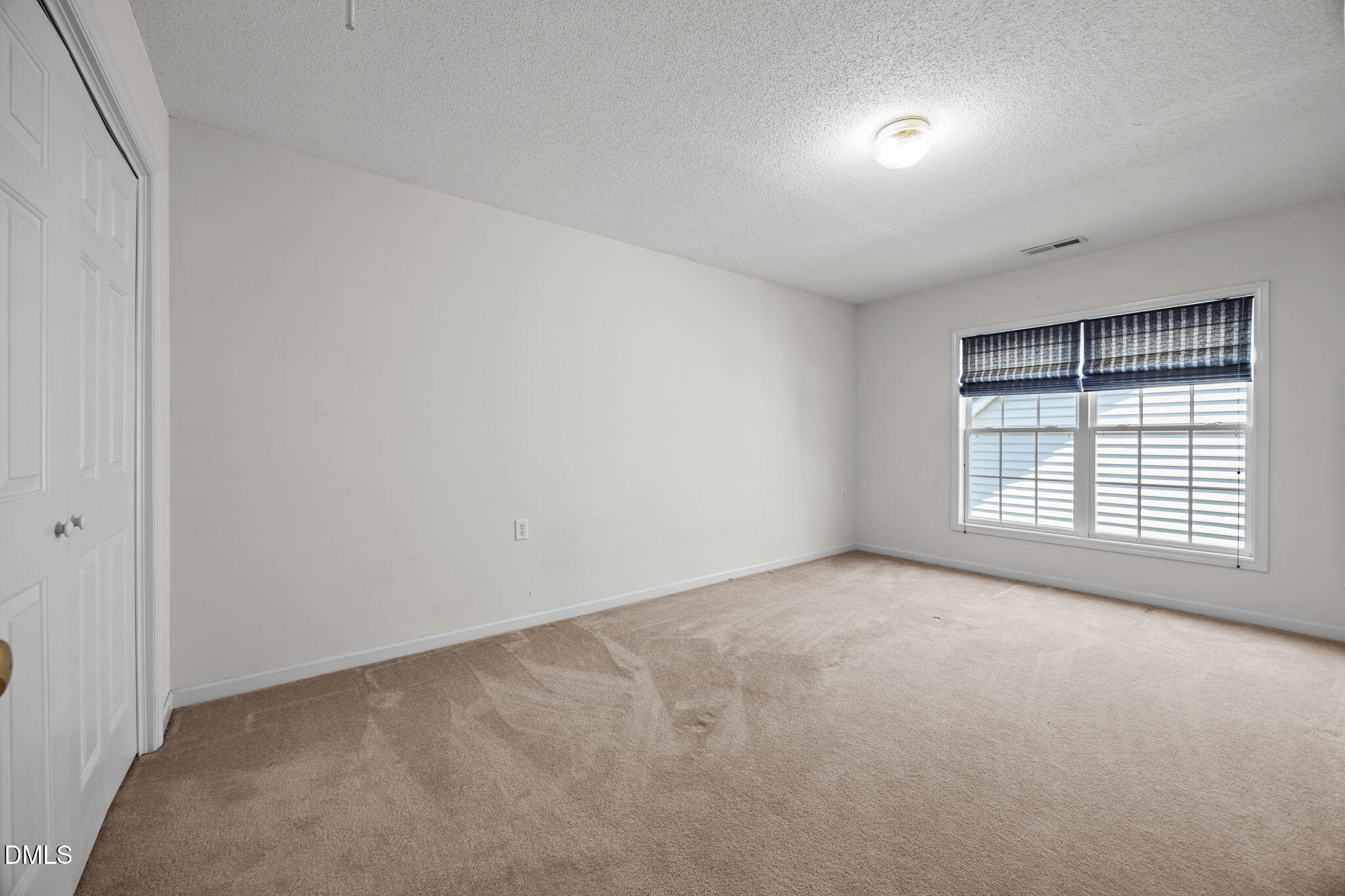 5501 Southern Cross Avenue Raleigh, NC 27606 - Photo 29 of 43 an empty room with a window