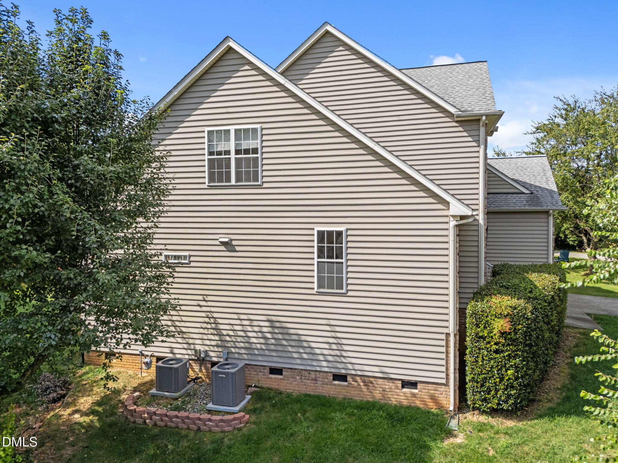 5501 Southern Cross Avenue Raleigh, NC 27606 - Photo 36 of 43 a view of a white house with many windows