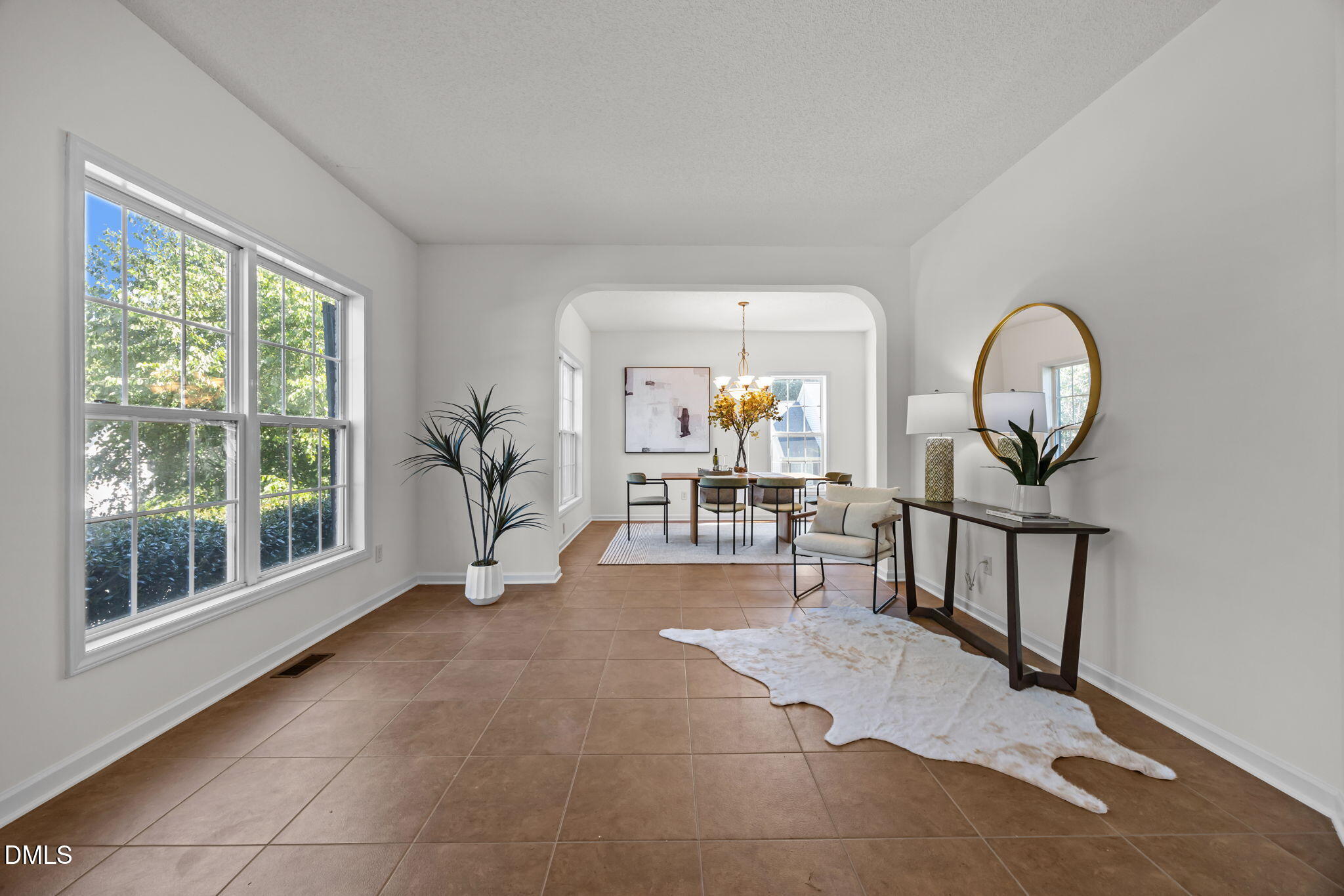 5501 Southern Cross Avenue Raleigh, NC 27606 - Photo 6 of 43 a view of a livingroom with furniture and a large window
