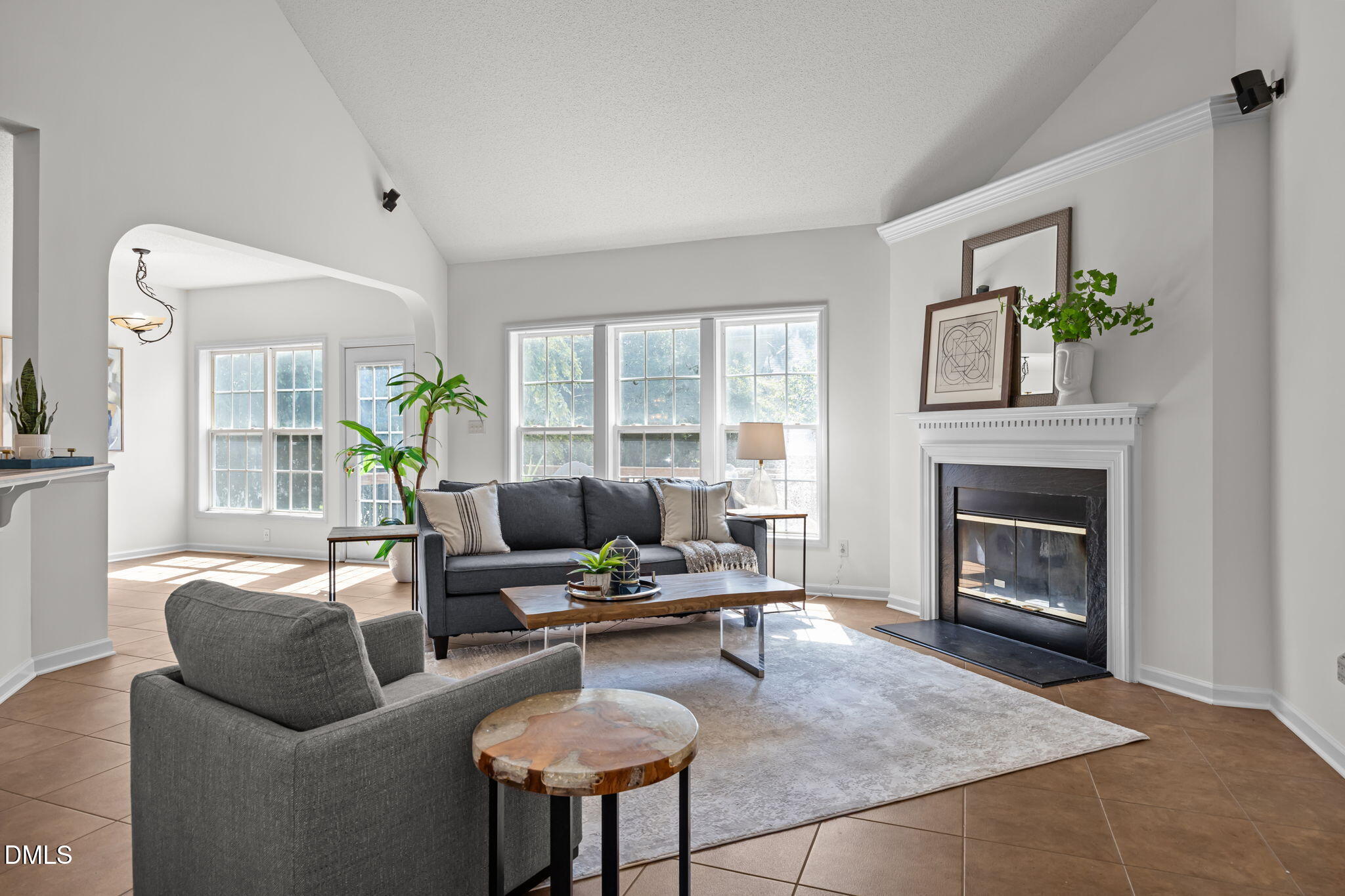 5501 Southern Cross Avenue Raleigh, NC 27606 - Photo 9 of 43 a living room with furniture and a fireplace