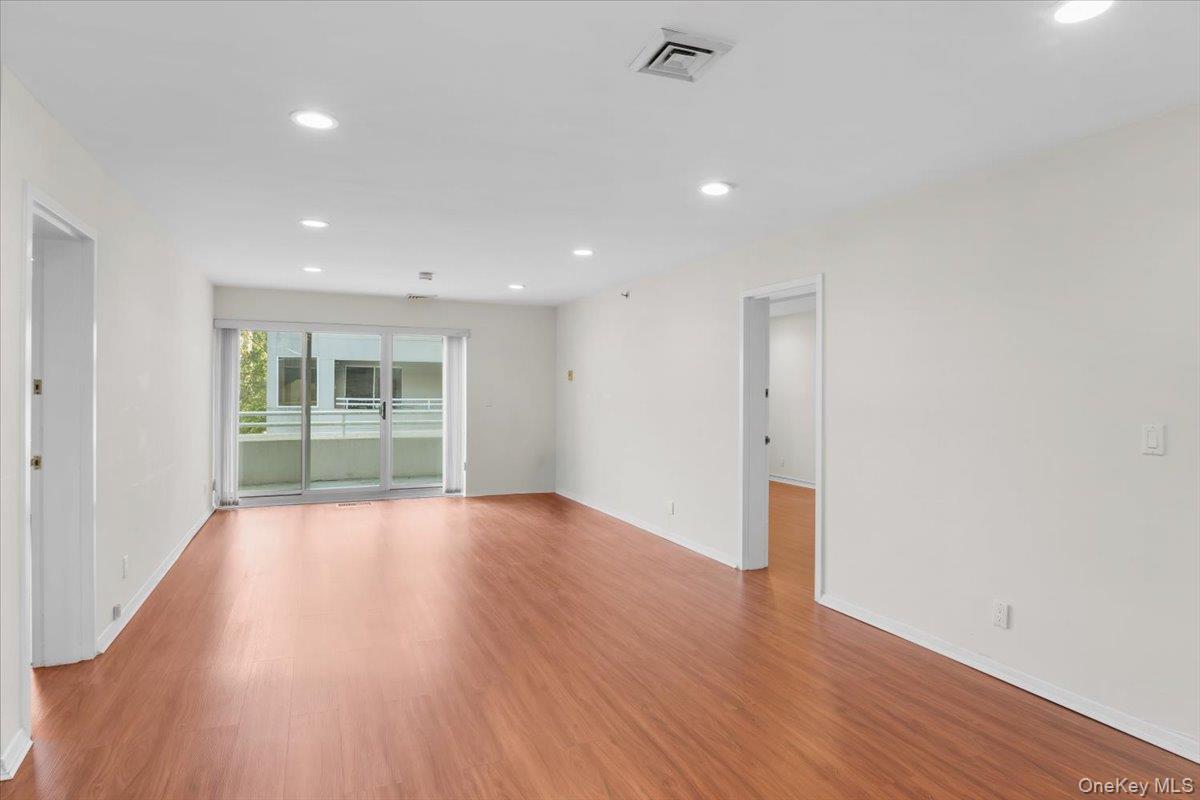 100 Cutter Mill Road, Unit 3F Great Neck, NY 11021 - Photo 15 of 33 a view of empty room with wooden floor and fan