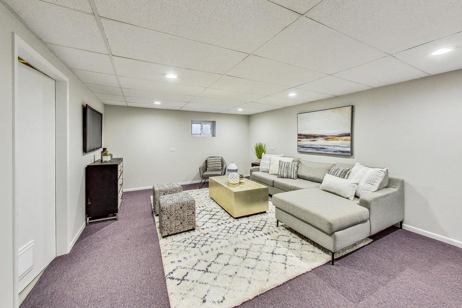 1724 Larkdale Road Northbrook, IL 60062 - Photo 23 of 31 a living room with furniture and a rug