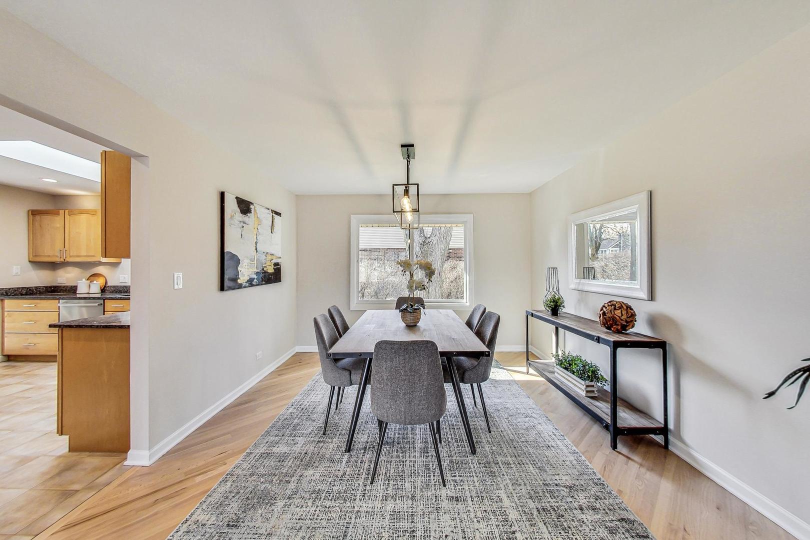1724 Larkdale Road Northbrook, IL 60062 - Photo 5 of 31 a view of a dining room with furniture window and wooden floor