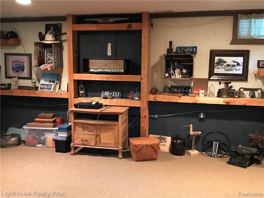 7150 Denton Hill Road Fenton, MI 48430 - Photo 31 of 47 Perfect man cave with built ins
