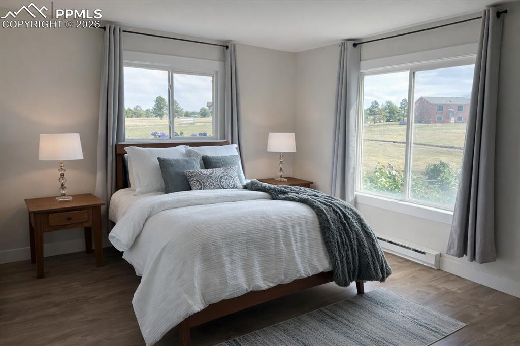 12285 Old Barn Road Elbert, CO 80106 - Photo 14 of 39 a bedroom with a bed and a large window